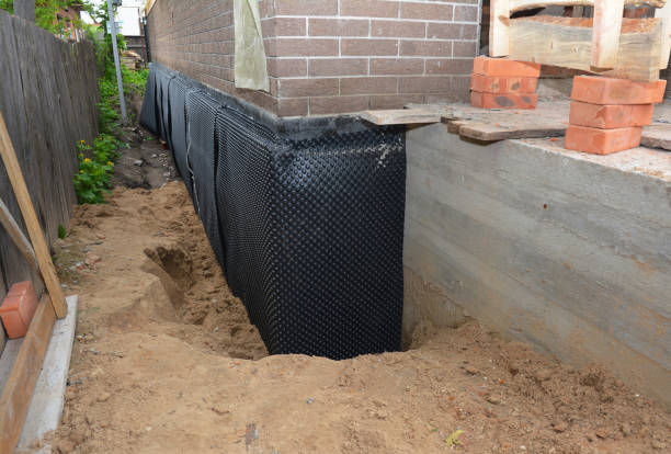 Happy homeowners after waterproofing job in Mill Neck